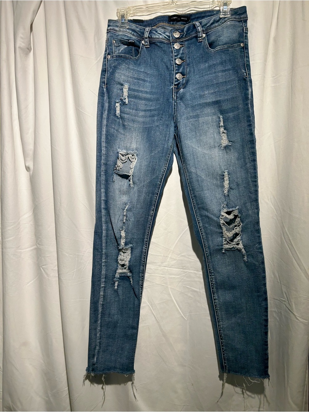 Almost Famous distressed button fly skinny jeans raw hem